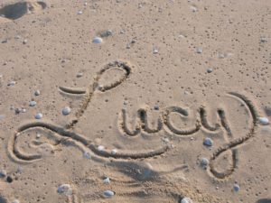 Lucy's name in the sand on the beach at Betsie Point Lighthouse. 